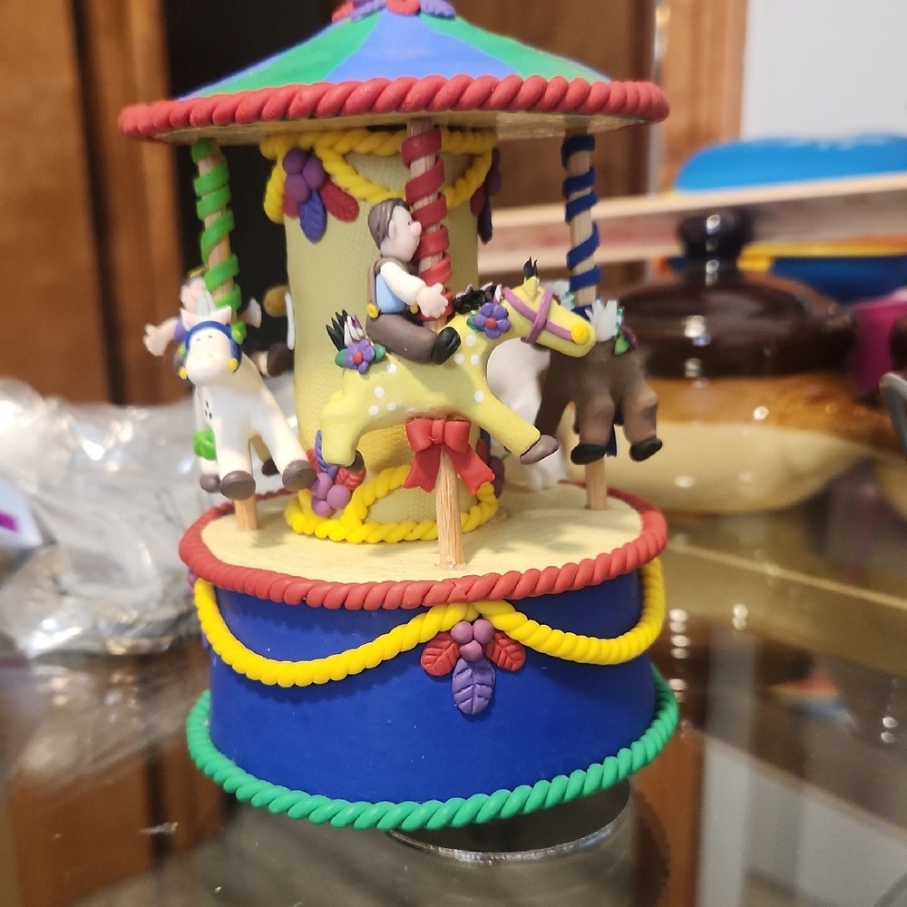 Coynes & Co. Vibrant Red and Blue Carousel Music Box with Cartoon Animals